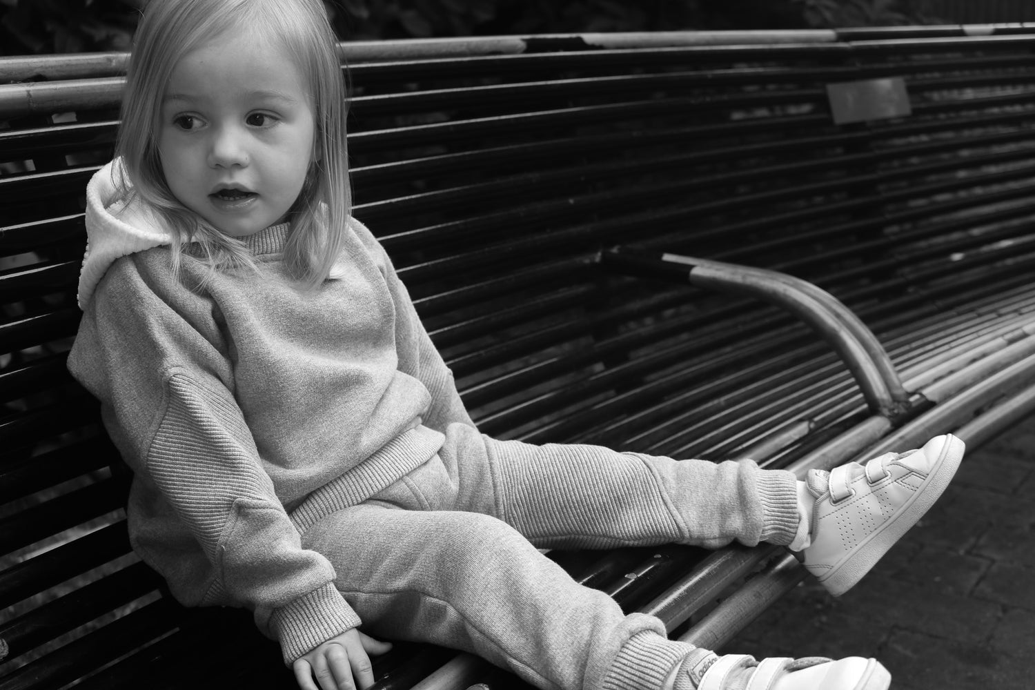 Editorial image of child wearing cosy jogger with rib detailing in organic cotton fleece, made in the uk