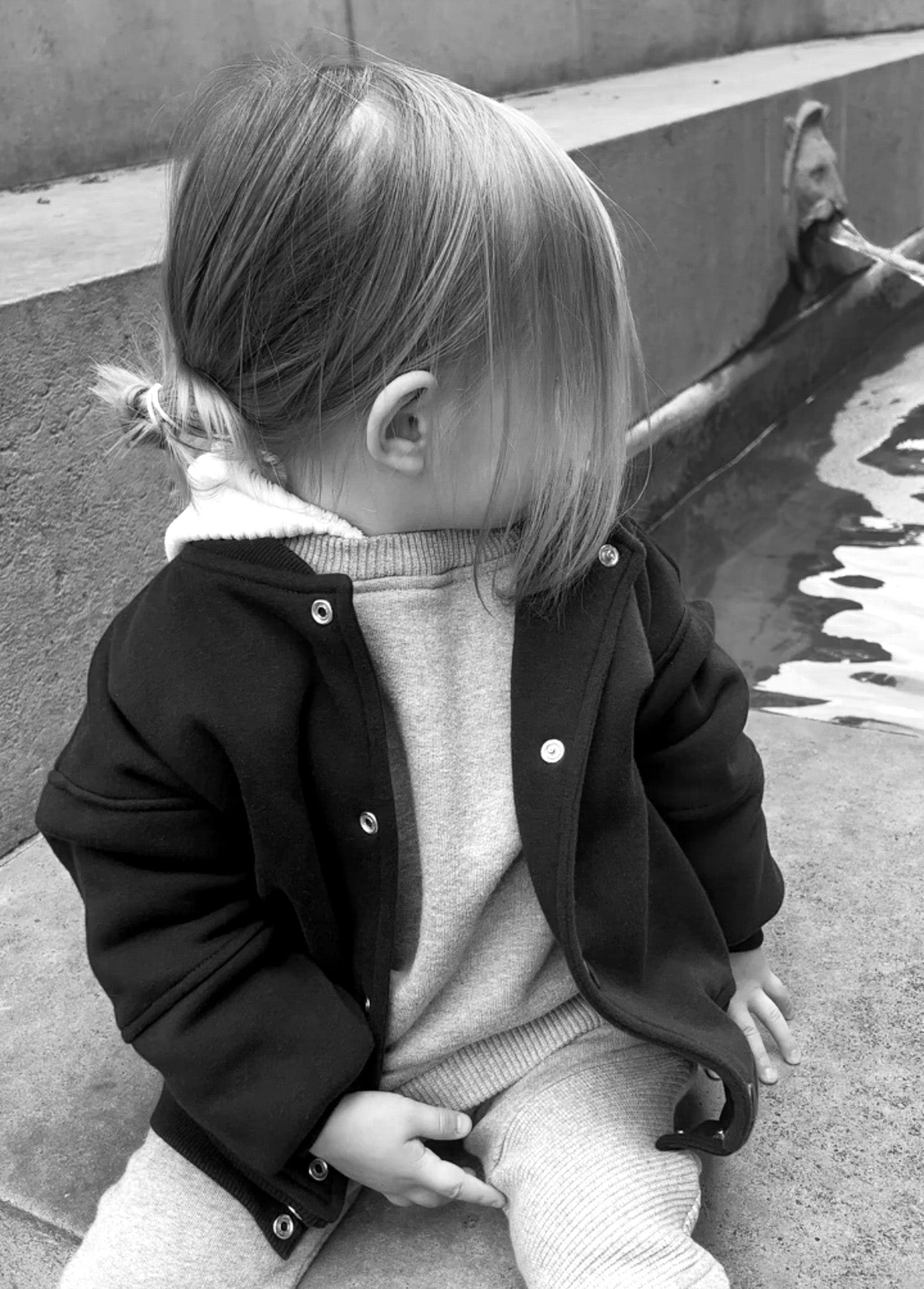 Editorial image of child with jacket on