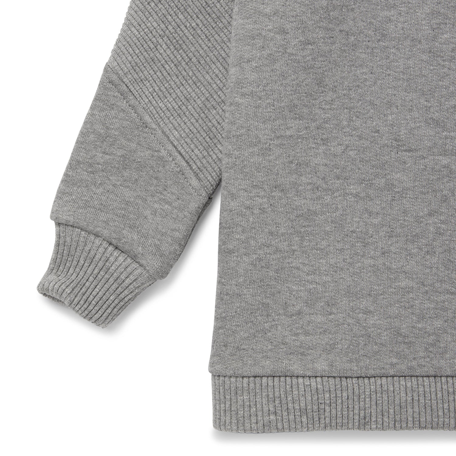 Detail view of sleeve on cosy hooded sweatshirt in organic brush back cotton with asymmetrical ribbing at sleeve